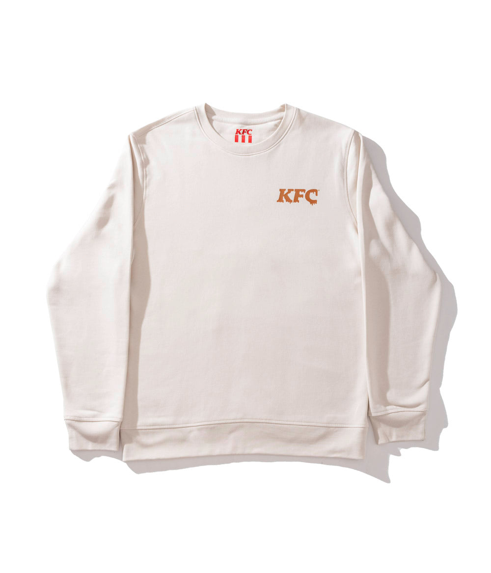 off white jumper with gold KFC logo on the front