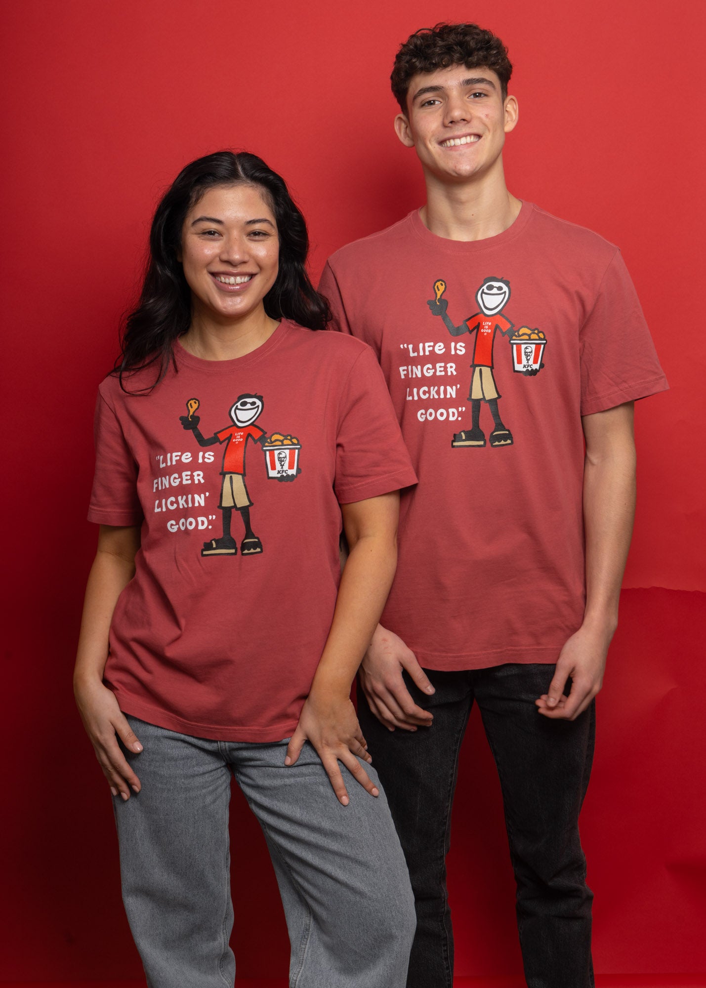 models wearing KFC x Life is Good collaboration red tee shirts