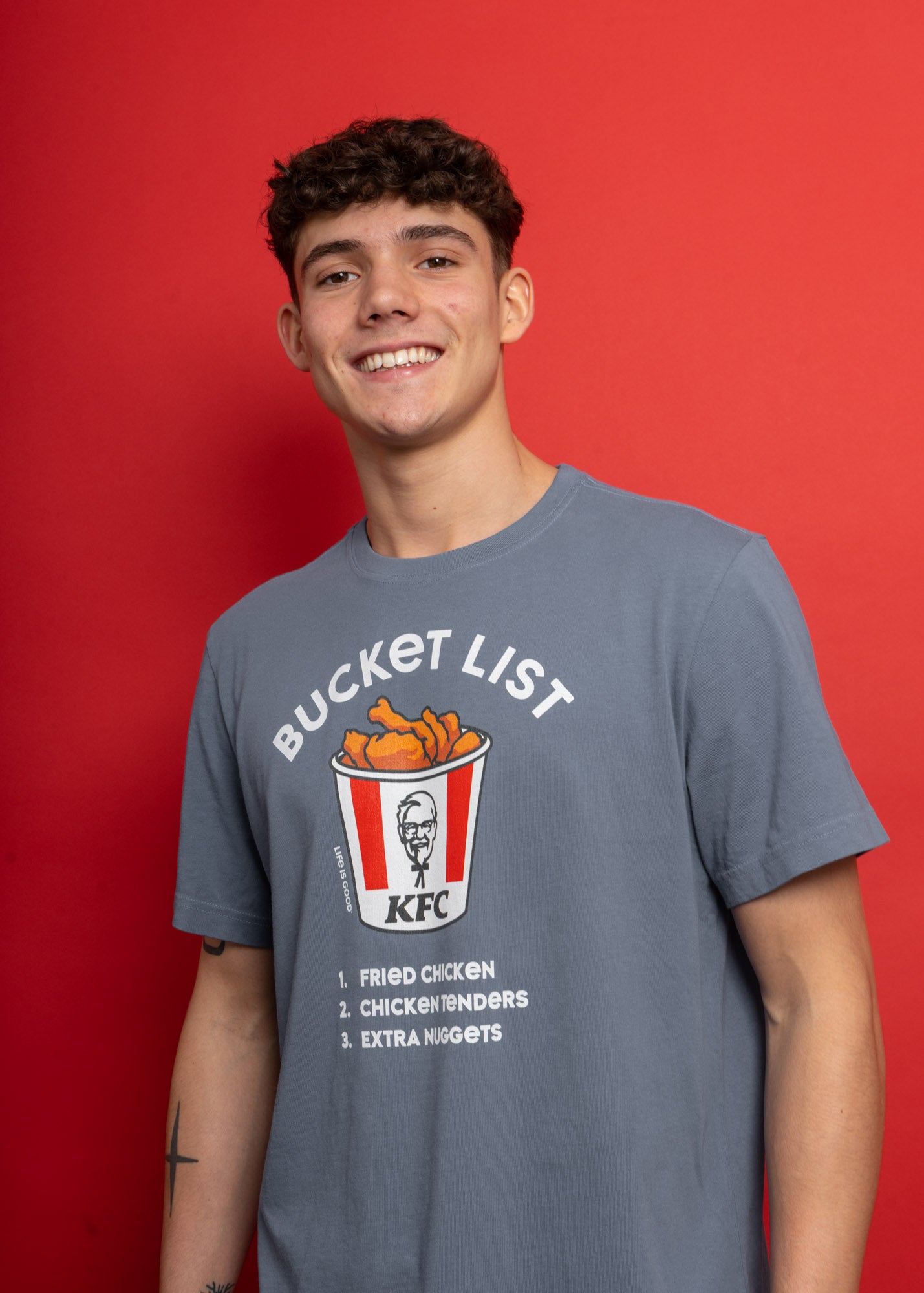 models wearing KFC x bucket list grey t shirts