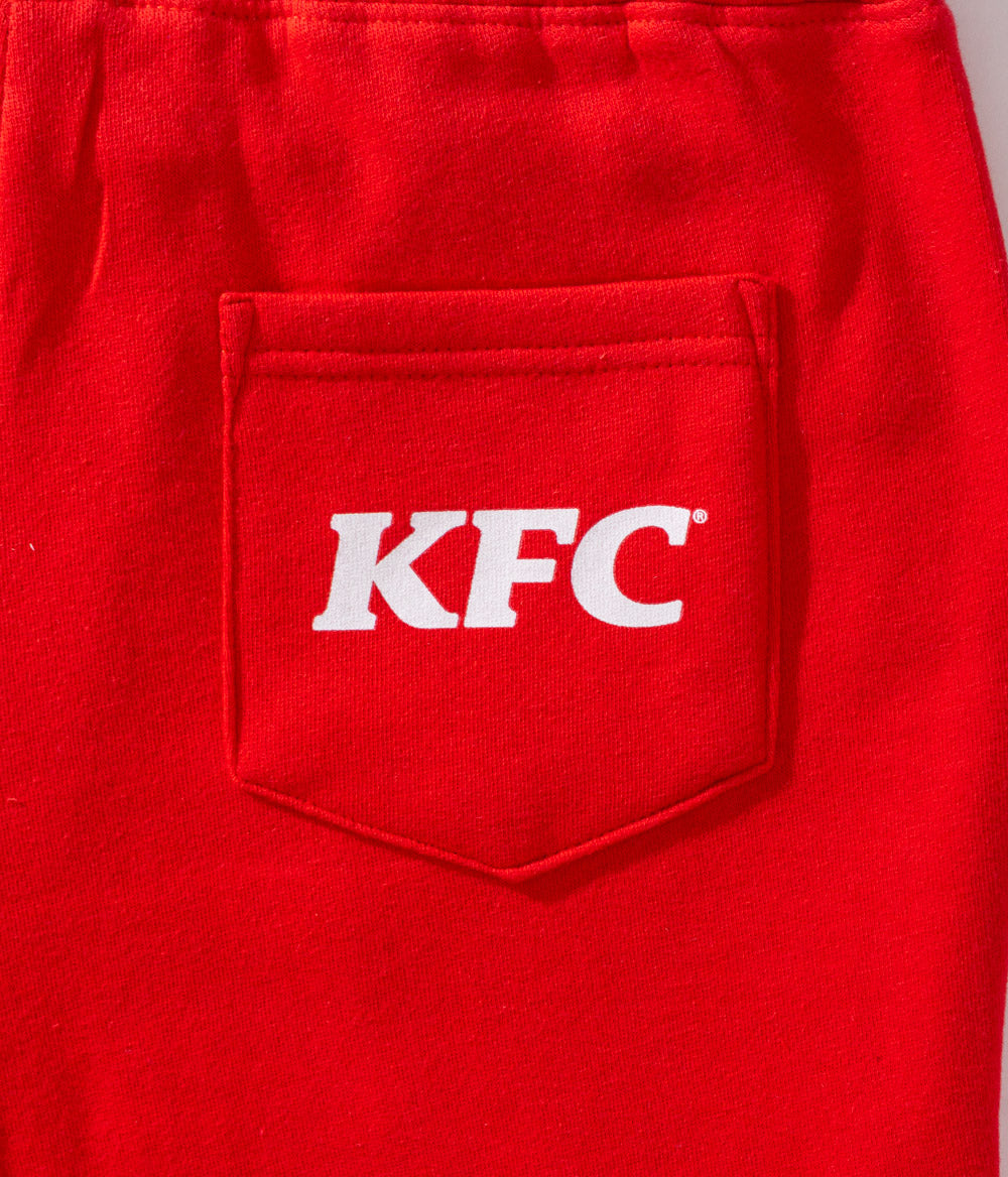 close up of red cotton shorts with white KFC logo pocket