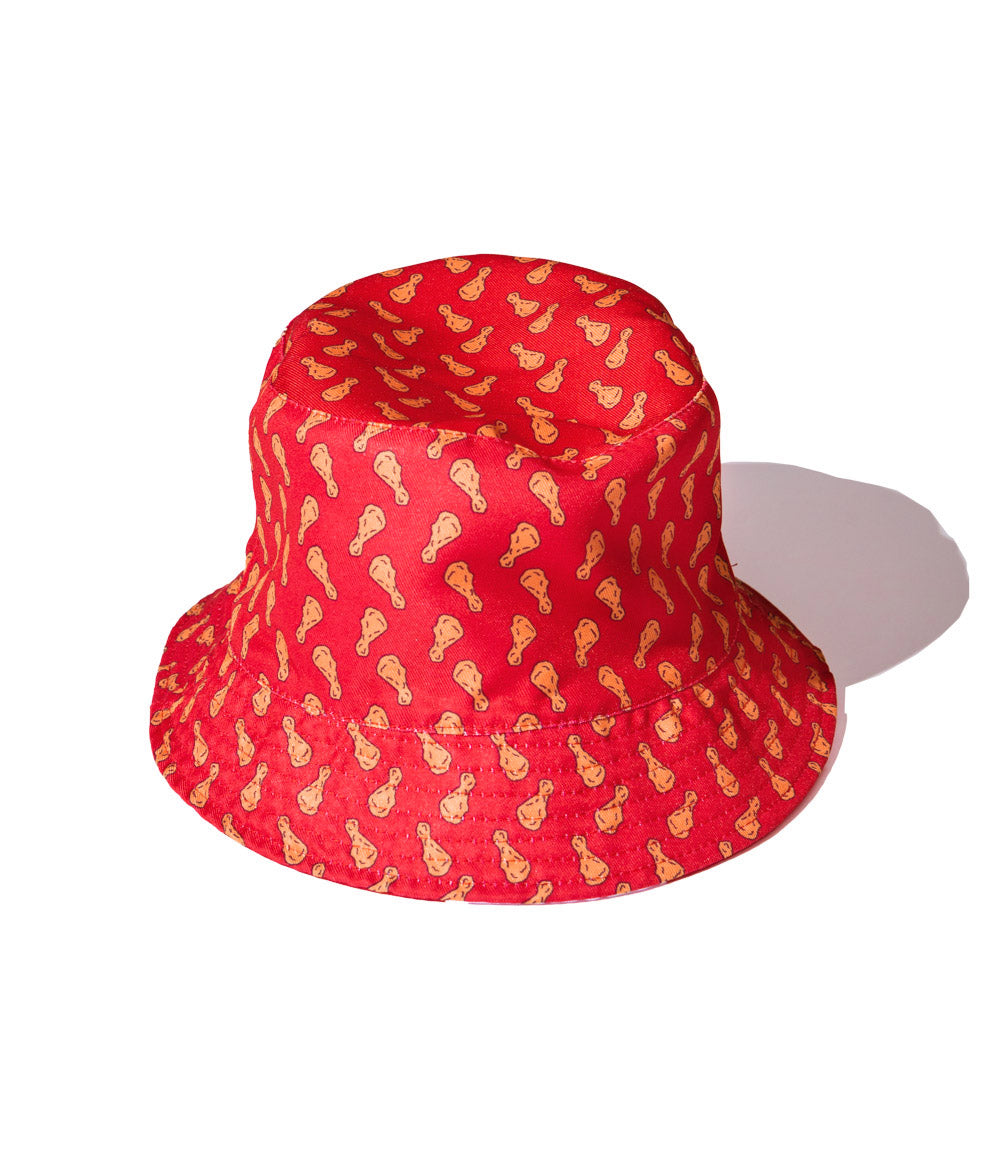 reversed KFC bucket hat with chicken drumstick pattern on red