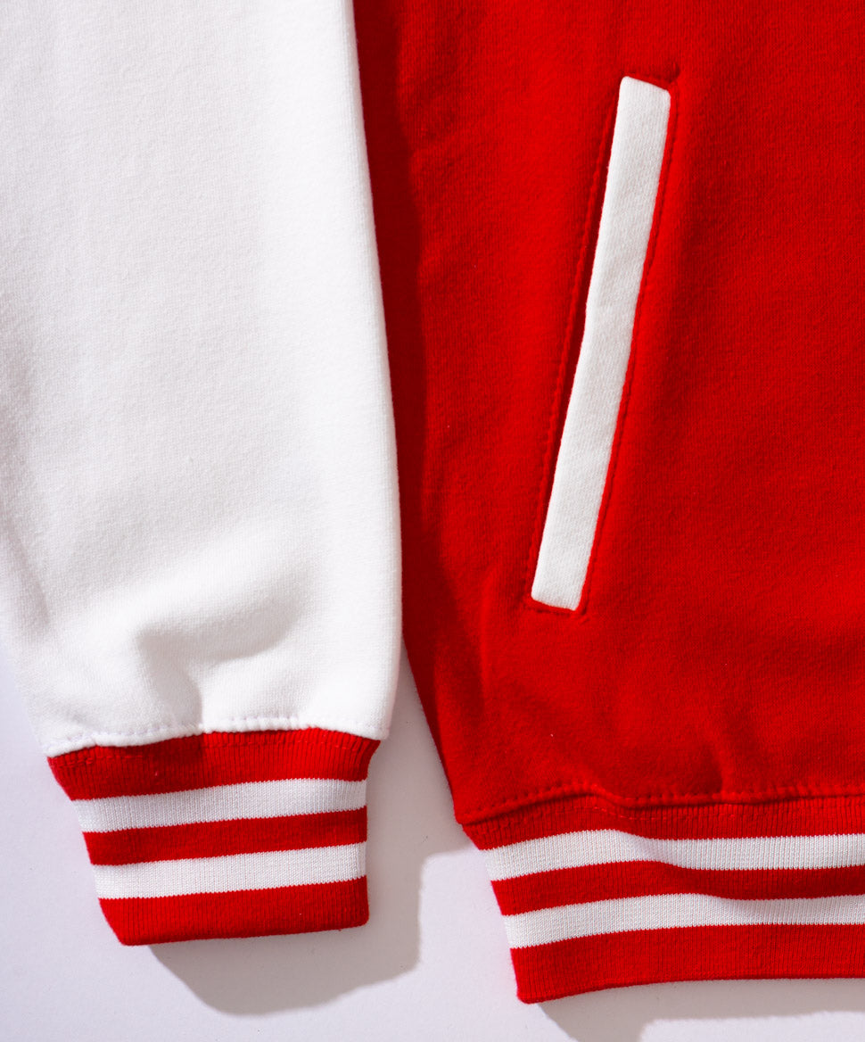 Red varisty jacket with KFC white logo on the back and white sleeves close up