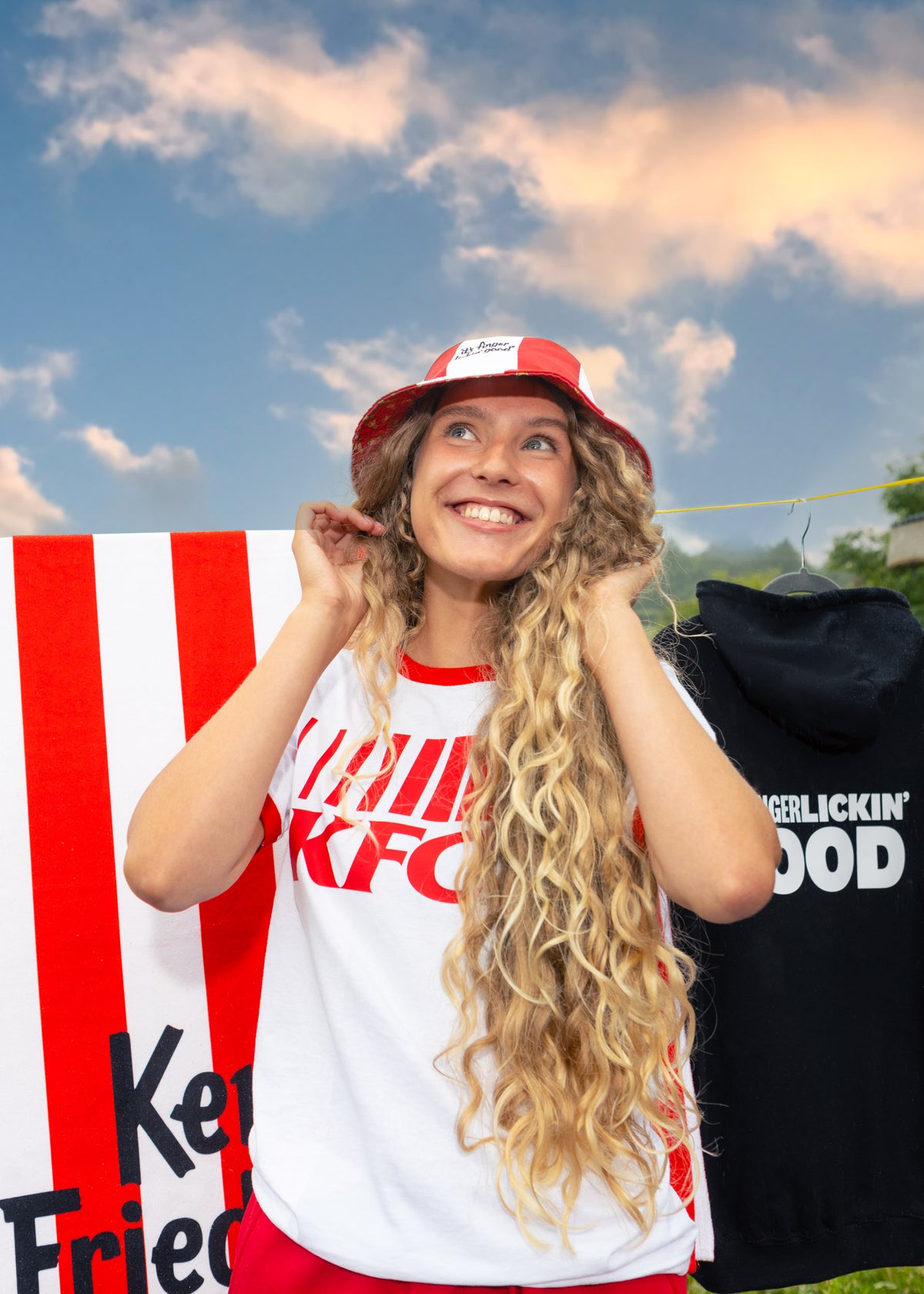 model outside wearing head to toe KFC merchandise