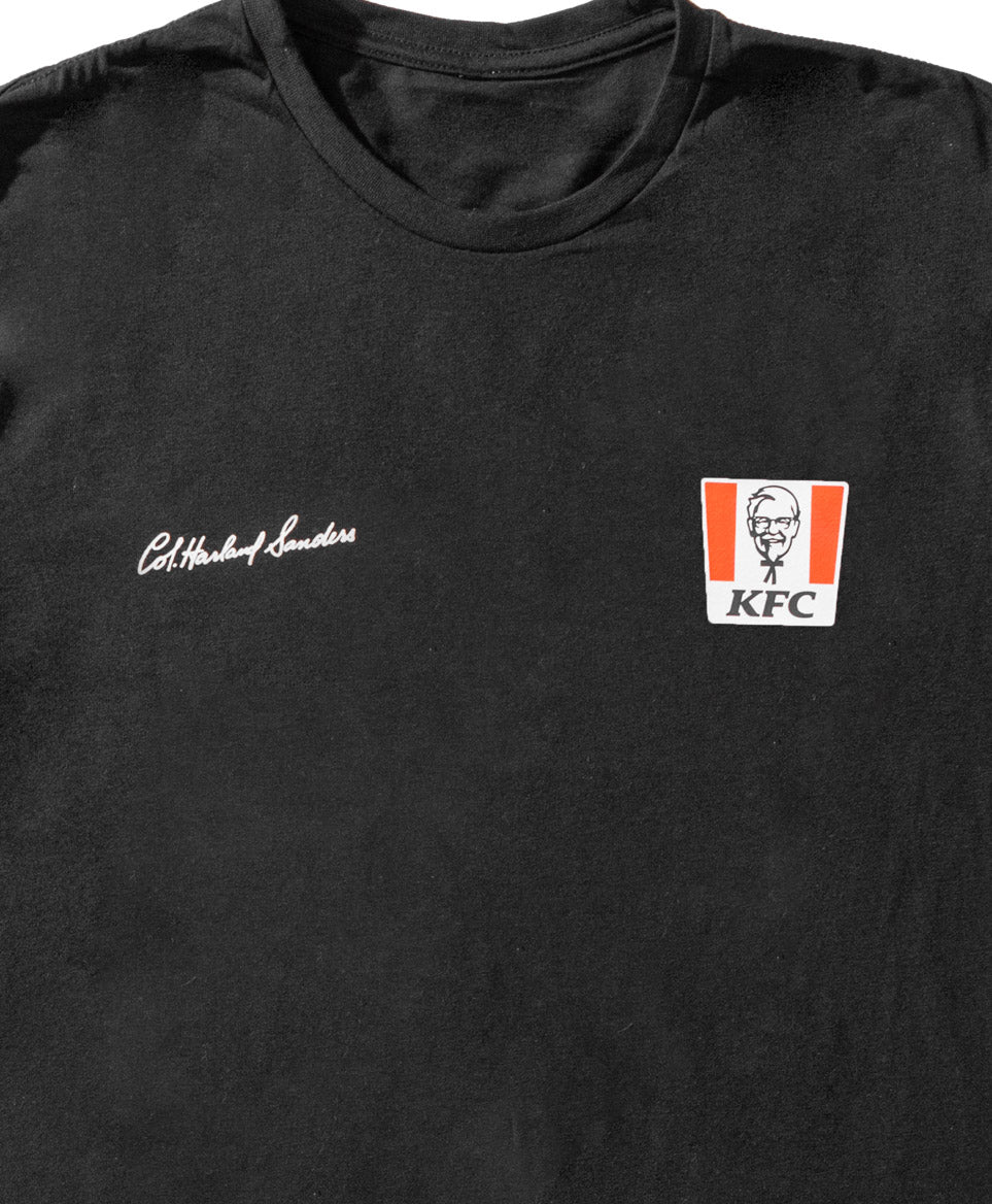 close up of Black long sleever jumper with KFC red bucket logo